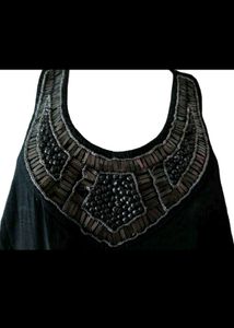 Elegant Black Jumpsuit with Embellished Neckline