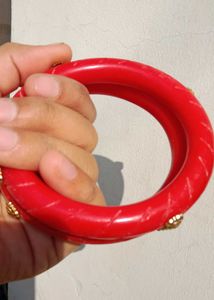 Vibrant Red Bangles with Gold Accents