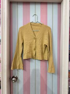 beige flared cardigan