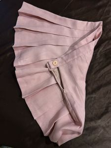 baby pink tennis skirt with pleats