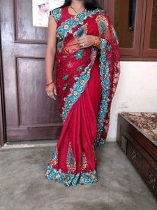 maroon color net saree with stiched blouse