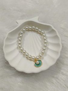 Elegant Pearl Bracelet with Shell Charm