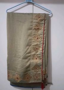 Elegant Beige Saree with Gold Embellishments