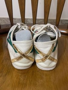 Classic White Sneakers with Green and Red Accents