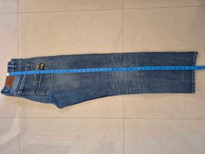 Distressed Blue Denim Jeans