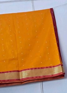 Vibrant Orange Saree with Gold Border