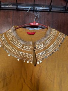Elegant Yellow Kurta with Embellished Neckline
