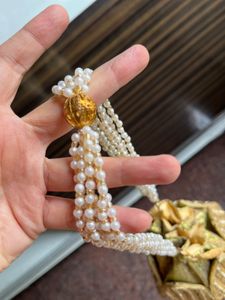 Elegant Gold Embellished Potli Bag