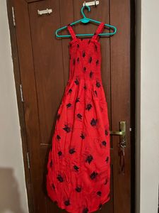red coloured fit and flare dress with lace shrug