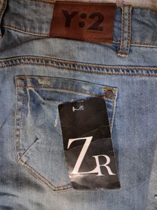Distressed Blue Denim Jeans
