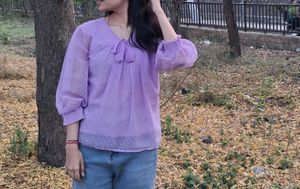 women dark levender color top with dobby print