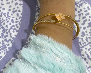Elegant Gold-Tone Bangle with Gemstones