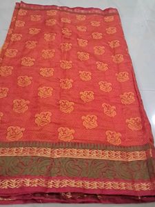 Elegant Orange Saree with Floral Motifs