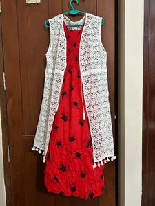 red coloured fit and flare dress with lace shrug