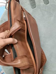 👜