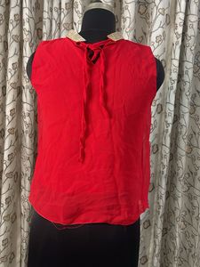 Red Embellished Neckline Sleeveless Blouse