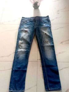 Distressed Blue Denim Jeans