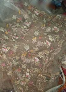 Embellished ivory net saree for engagement