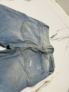 Distressed Blue Denim Jeans