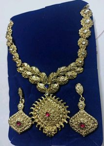 Golden Jewellery With Pink Stones