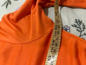 Orange Turtleneck Graphic Top