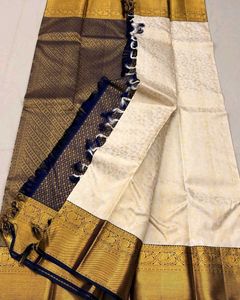 Elegant Off-White Saree with Gold Border