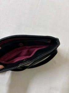 Black Leather Shoulder Bag with Lotus Design