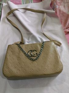 Stylish Beige Shoulder Bag with Chain Detail