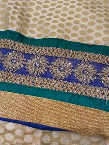 Embellished Beige Saree with Blue Border