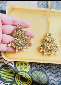 Gold jhumka earrings with maangtikka