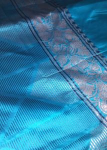 Elegant Teal Saree with Intricate Border