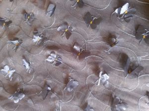 Gray net saree with butterfly patch work.