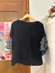 Black top with statement sleeves