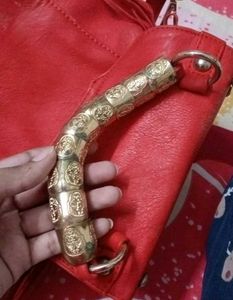 Chic Red Handbag with Gold Accent Handle