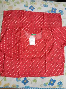 Red printed kurta with matching nail polish