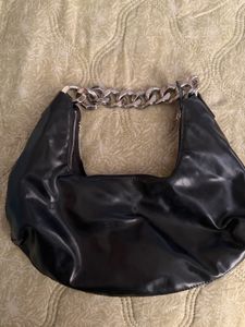 Black hobo bag with metal chain