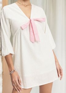 White Textured Dress with Pink Bow