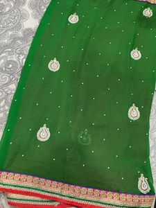 Elegant Heavy Green And Pink Embellished Saree