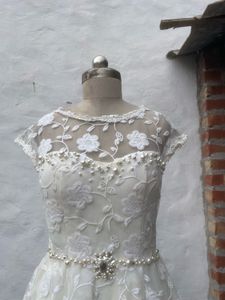 Elegant White Lace Peplum Gown