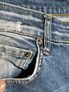 Distressed Blue Jeans
