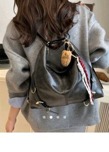 adjustable buckle shoulder bag