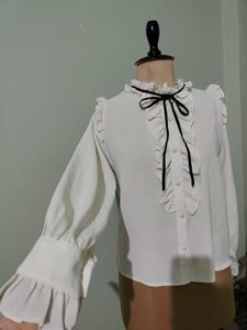 Ruffled White Blouse with Black Bow