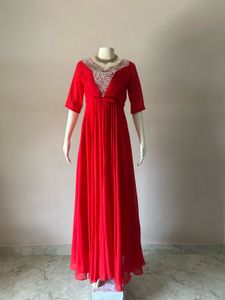 Elegant Red Gown with Embellished Neckline