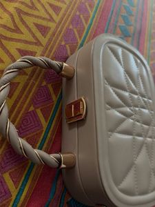 Quilted Oval Handbag