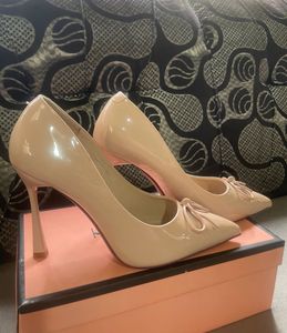 Elegant Nude Patent Bow Pumps