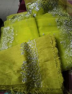 Stunning Yellow Embellished Net Saree