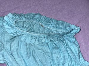 Ruffled Off-Shoulder Blouse.