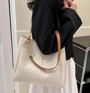 Chic Cream Tote Bag with Gold Chain Accents