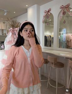 coquette pink sweater sleeve
