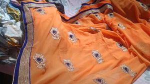 Orange Saree with Blue Velvet Blouse